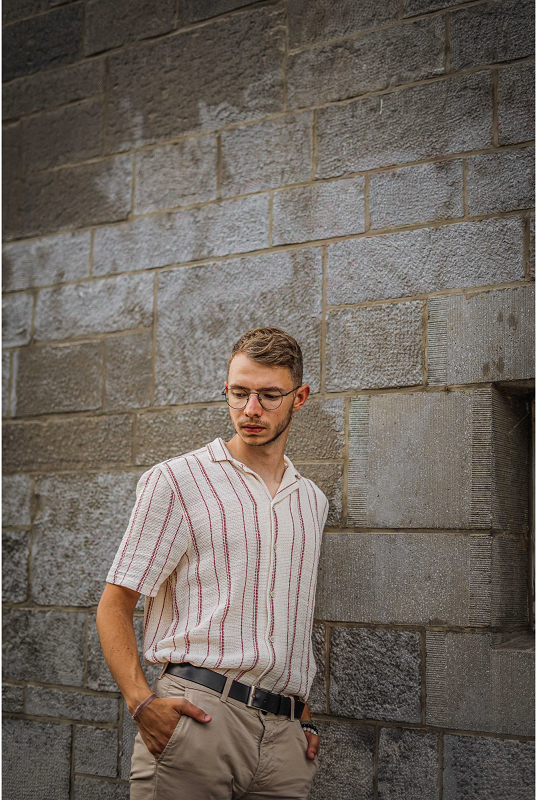 A man leaning on a wall